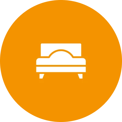 Icon of a bed on an orange circular background.